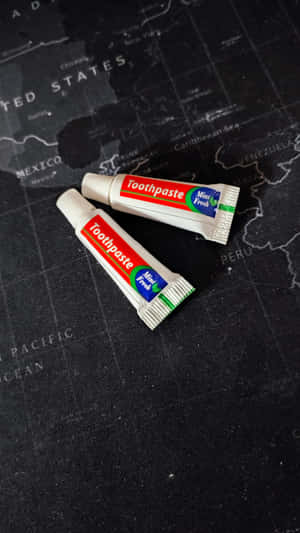 Travel Size Toothpasteon Map Wallpaper