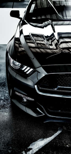 Treat Yourself To The Latest Iphone Featuring A Mustang Logo Wallpaper