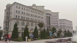 Trees And Palace Building In Tajikistan Wallpaper