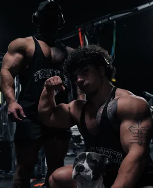 Tren Twins_ Gym_ Flex_with_ Dog.jpg Wallpaper