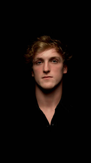 Trendsetter Logan Paul In Bold Red Jacket Wallpaper