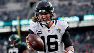 Trevor Lawrence In Action Jaguars Quarterback Wallpaper