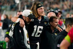 Trevor Lawrence Injured Assisted Off Field Wallpaper