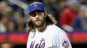 Trevor Williams Throwing A Curveball In A Baseball Game Wallpaper