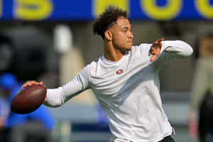 Trey Lance Quarterback Throwing Football Wallpaper