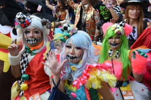 Trick-or-treaters Participating In The Annual Halloween Parade Wallpaper