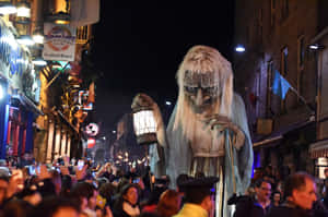 Trick-or-treaters Showing Off Their Costumes During A Halloween Parade Wallpaper