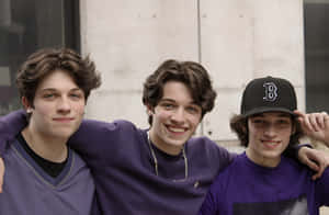 Tripletsin Purple Smiling Outdoors Wallpaper