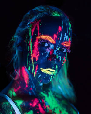 Trippy Dark Girl With Neon Paint Wallpaper