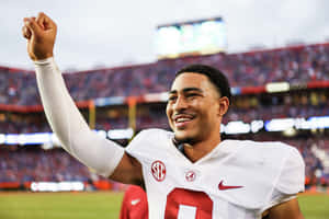 Triumphant Football Player Celebrating Victory Wallpaper