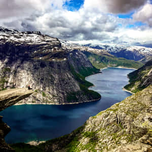 Trolltunga And Scenic Rock Formations Wallpaper