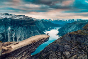 Trolltunga Under The Dark Clouds Wallpaper