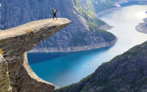 Trolltunga Victory Pose Stavanger Norway Wallpaper