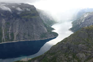 Trolltunga With Thick White Fog Wallpaper