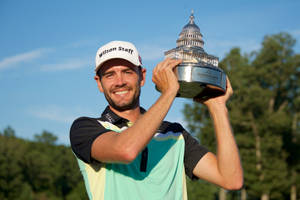 Troy Merritt Smiling And Holding Trophy Wallpaper