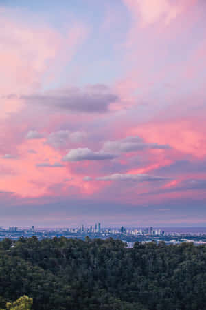 Trrippy Aesthetic Clouds Over A City Wallpaper