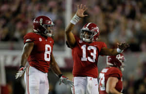 Tua Tagovailoa High Five Wallpaper