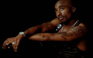 Tupac Shakur Contemplative Pose Wallpaper