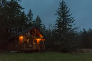 Twilight Log Cabin Retreat Wallpaper