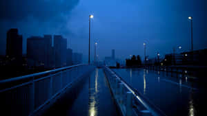 Twilight Rainy Cityscape Walkway Wallpaper