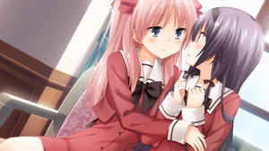 Two Anime Girls Sitting On A Chair And Hugging Wallpaper