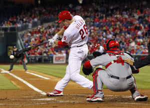 Two Baseball Players Share A Moment Of Celebration Wallpaper