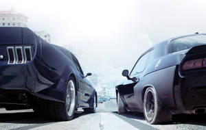 Two Black Cars Are Parked On A Street Wallpaper