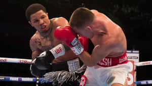 Two Boxers In The Ring Fighting Each Other Wallpaper