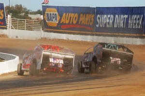 Two Dirt Cars Racing Wallpaper