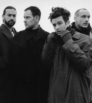 Two Excited Guys Embracing With Joy Wallpaper