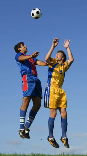 Two Football Galaxy Athletes With Ball Above Wallpaper