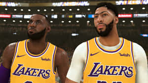 Two Lakers Players Standing Next To Each Other Wallpaper