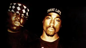 Two Men Are Smoking A Cigarette Wallpaper