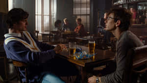 Two Men Conversation Pub Scene Wallpaper