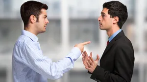 Two Men Disagreeing At Work.jpg Wallpaper