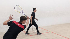 Two Men In Squash Court Wallpaper