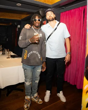 Two Men Posingat Event Wallpaper