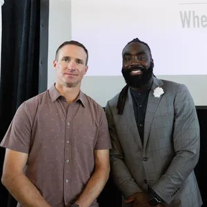 Two Men Presentingat Event Wallpaper