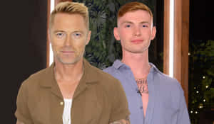 Two Men Standing Sideby Side Wallpaper