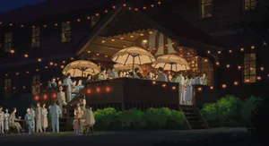 Two People Hold Each Other Tight In The Wind Wallpaper