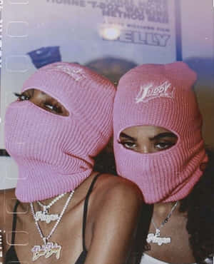 Two Women Wearing Pink Hats And A Necklace Wallpaper