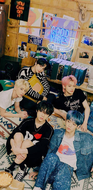 Txt With Books And Neon Lights Wallpaper