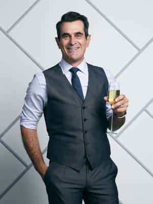 Ty Burrell, Smiling In A Black Suit And Tie Wallpaper