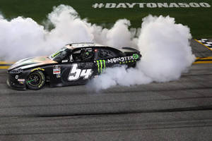 Ty Gibbs Victoriously Smoking Tires At Daytona 500 Wallpaper