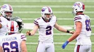 Tyler Bass Celebratingwith Teammates Wallpaper