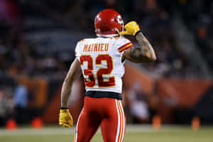 Tyrann Mathieu Of The Kansas City Chiefs Flying Through The Air, Ready To Make The Tackle Wallpaper