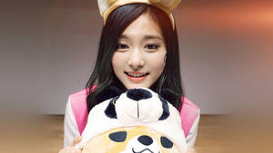 Tzuyu With Cute Stuffed Toy Wallpaper