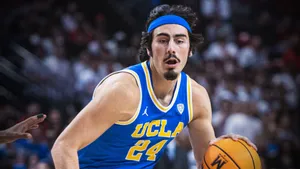 U C L A Basketball Player Action Shot Wallpaper