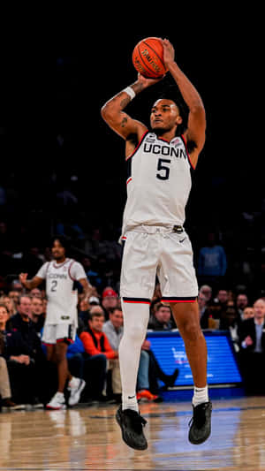 U Conn Basketball Player Jump Shot Wallpaper