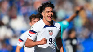 U S A Soccer Player Celebration Wallpaper